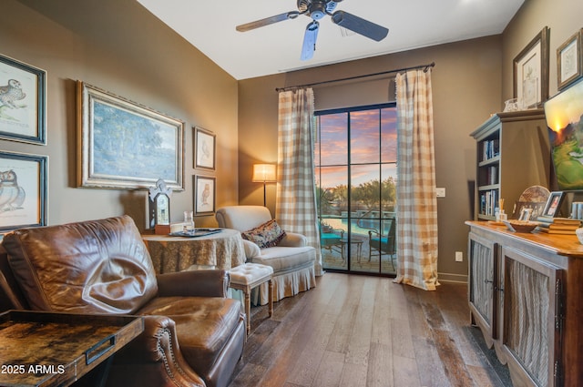 sitting room featuring ceiling fan, plenty of natural light, and hardwood / wood-style flooring