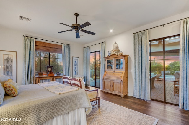 bedroom with ceiling fan, access to outside, and dark hardwood / wood-style flooring