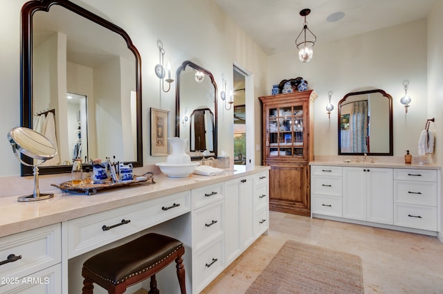 bathroom featuring vanity and a notable chandelier