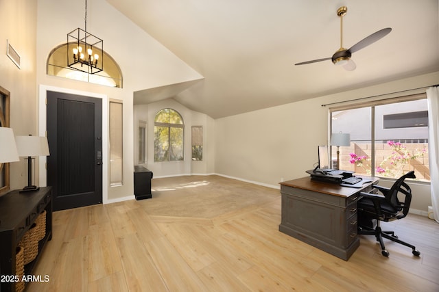 office space featuring high vaulted ceiling, ceiling fan with notable chandelier, light wood-type flooring, baseboards, and visible vents