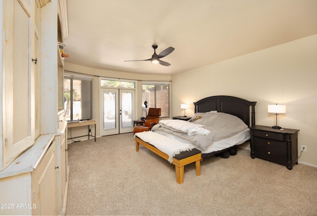 carpeted bedroom with access to exterior, a ceiling fan, and french doors