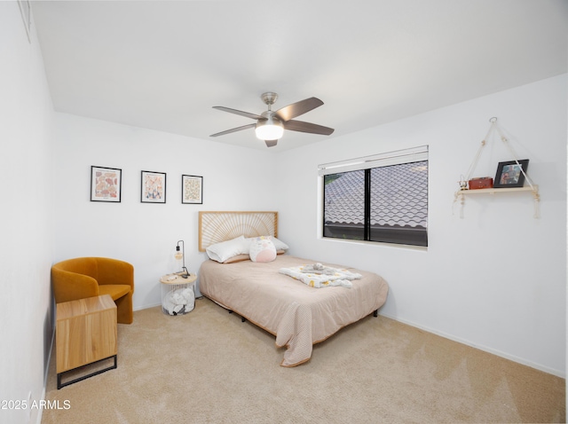 bedroom with baseboards, carpet floors, and ceiling fan