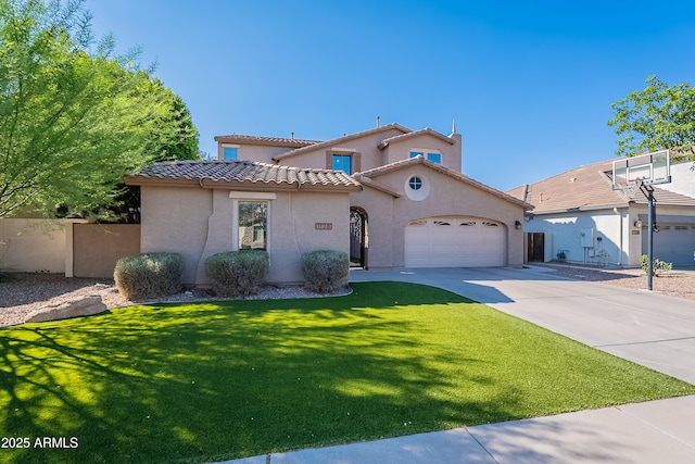 1128 E Phelps St, Gilbert, AZ 85295 - mediterranean / spanish-style house featuring an attached garage, stucco siding, concrete driveway, and a tiled roof