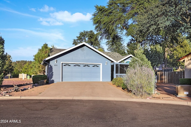 single story home featuring a garage