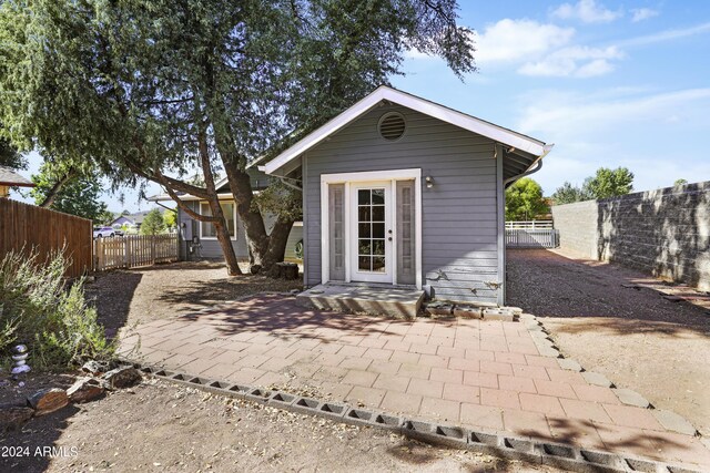 view of outdoor structure featuring an outbuilding and a fenced backyard