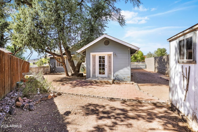 rear view of house with a patio