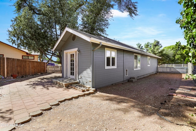 back of house with a patio