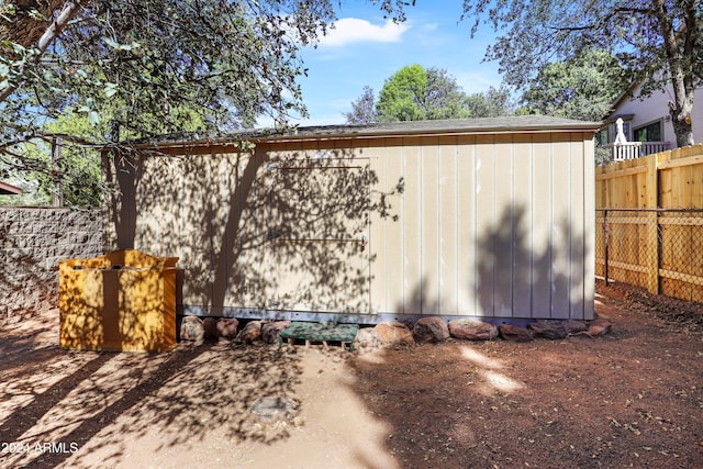 view of home's exterior featuring a storage unit