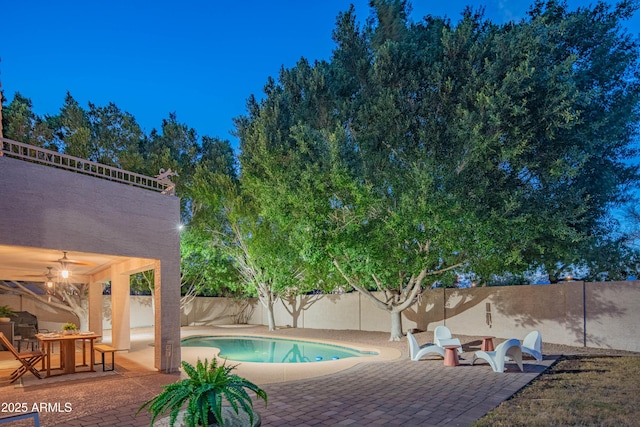 view of pool featuring a patio area, a fenced backyard, and a fenced in pool