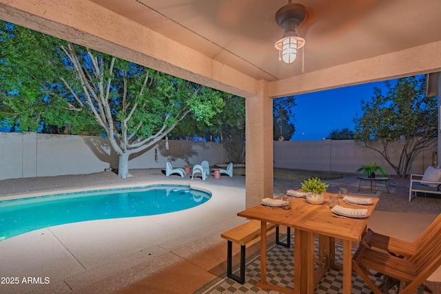 view of swimming pool with a fenced in pool, a fenced backyard, and a patio