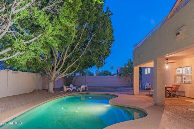 view of pool featuring a fenced backyard, a fenced in pool, and a patio