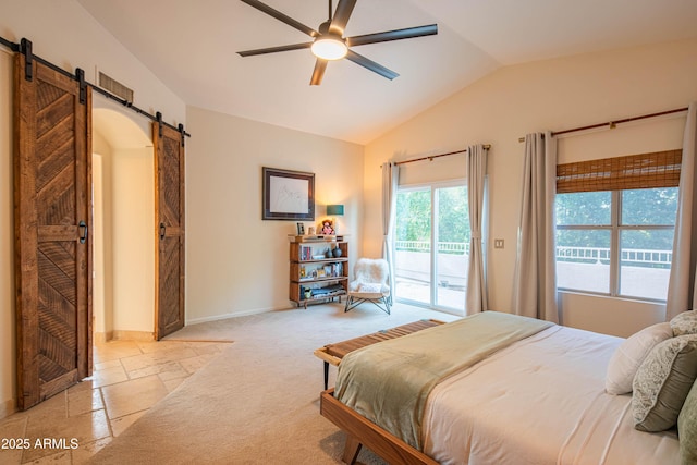 bedroom featuring lofted ceiling, ceiling fan, a barn door, baseboards, and access to exterior