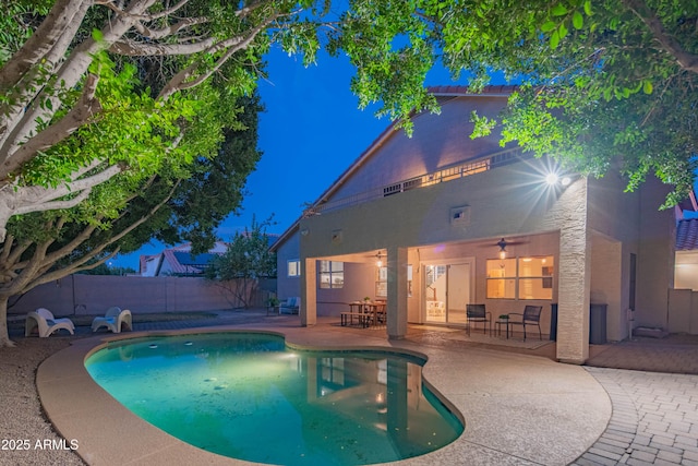 view of pool featuring ceiling fan, a patio area, a fenced backyard, and a fenced in pool