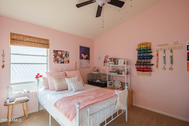 carpeted bedroom with baseboards, vaulted ceiling, and a ceiling fan