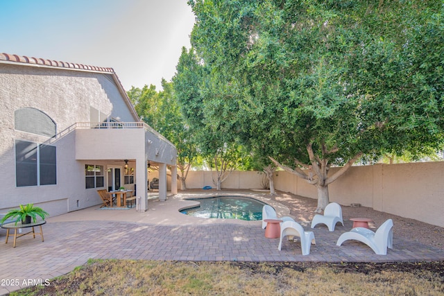 view of swimming pool with a patio, a fenced backyard, a ceiling fan, and a fenced in pool