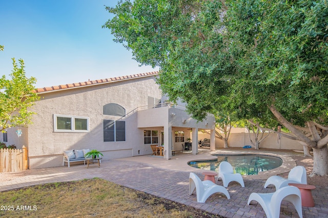 view of swimming pool featuring a patio, a fenced backyard, and a fenced in pool