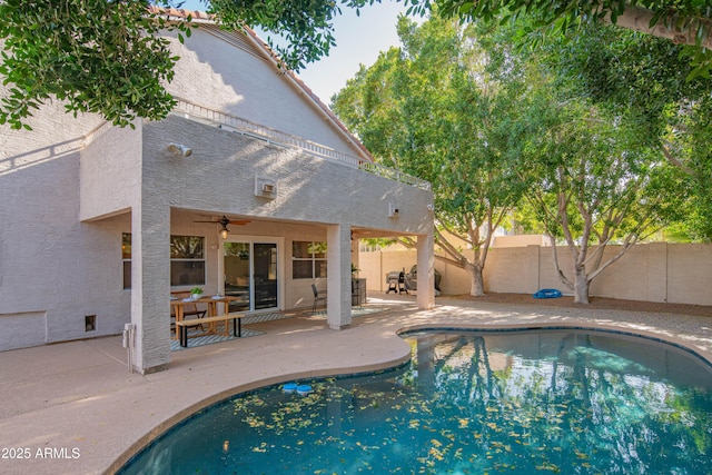 view of pool featuring a fenced backyard, a fenced in pool, and a patio