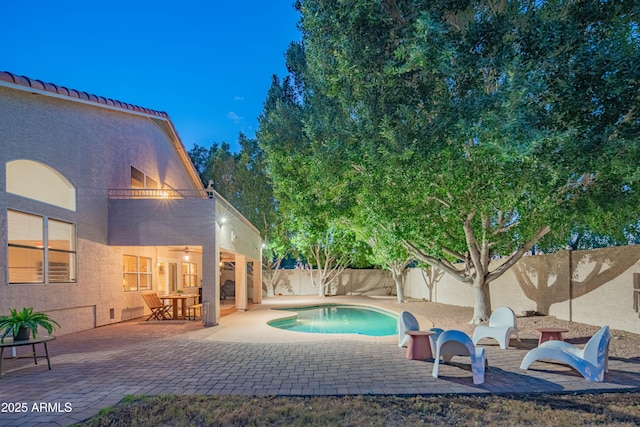 view of pool featuring a patio area, a fenced backyard, and a fenced in pool