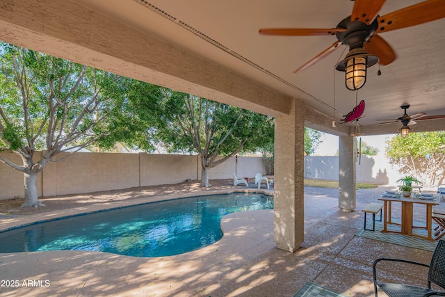 view of pool featuring ceiling fan, a patio, a fenced backyard, and a fenced in pool