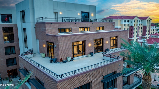 view of back house at dusk