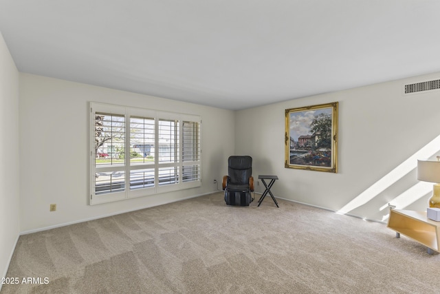 unfurnished room with visible vents and carpet flooring