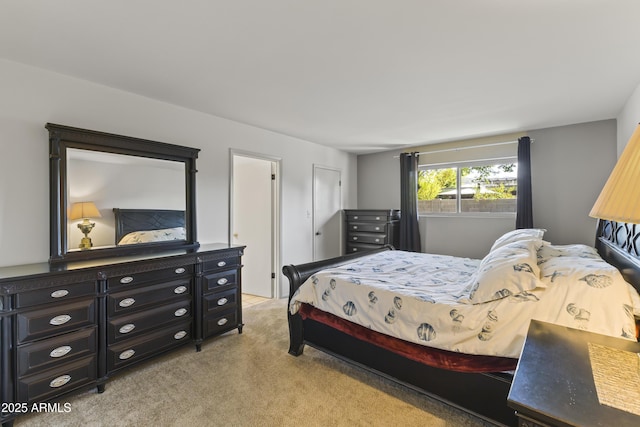 bedroom featuring light carpet