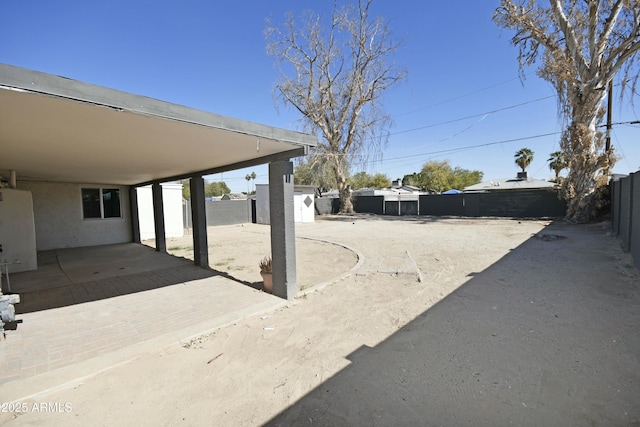 view of patio / terrace with a shed