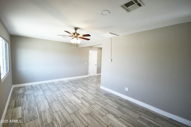 empty room featuring ceiling fan and light wood-type flooring