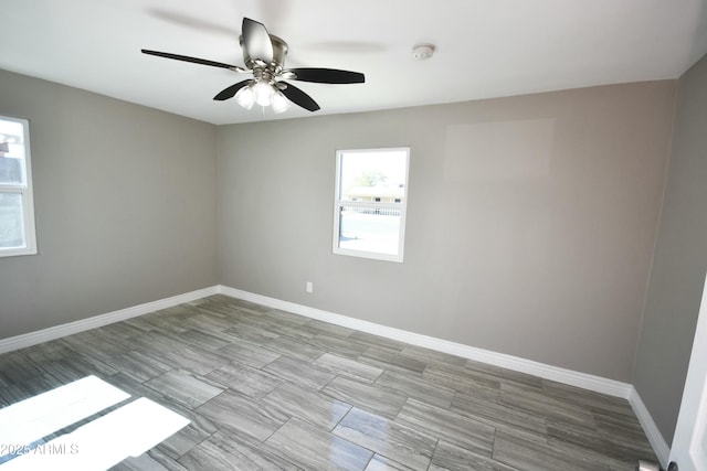 spare room with ceiling fan