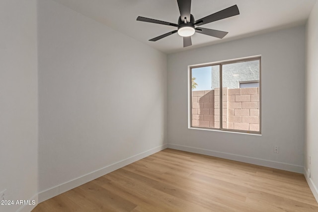 spare room featuring ceiling fan and light wood-type flooring