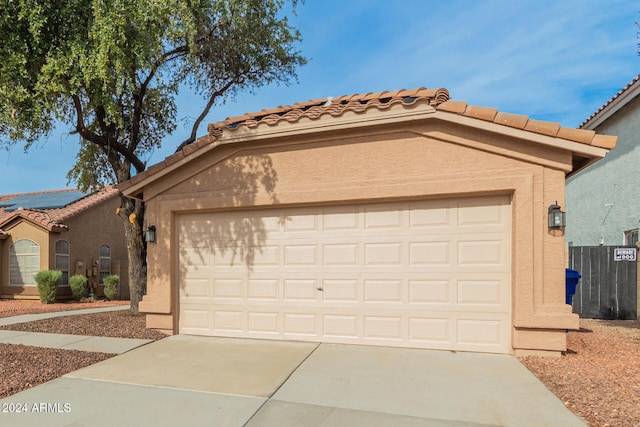 mediterranean / spanish house with a garage