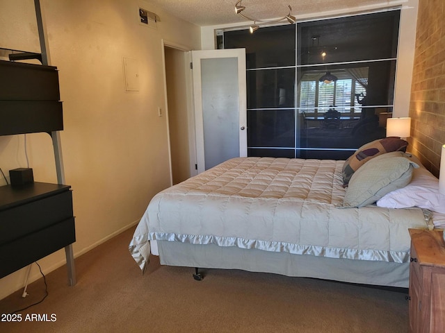 8220 E Garfield St Unit M214, Scottsdale, AZ 85257 - bedroom featuring carpet floors and a textured ceiling