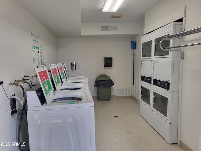 8220 E Garfield St Unit M214, Scottsdale, AZ 85257 - community laundry room with visible vents, stacked washer / dryer, light floors, and separate washer and dryer