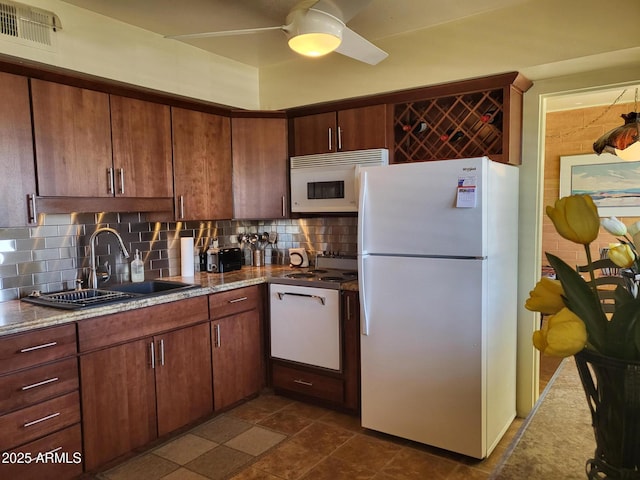 8220 E Garfield St Unit M214, Scottsdale, AZ 85257 - kitchen with tasteful backsplash, visible vents, white appliances, and a sink