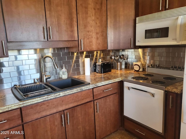 8220 E Garfield St Unit M214, Scottsdale, AZ 85257 - kitchen with white appliances, light stone counters, decorative backsplash, and a sink