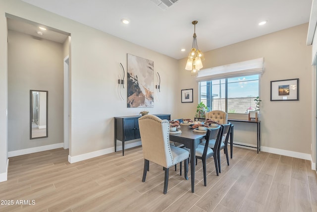 dining space with light wood-style floors, baseboards, visible vents, and recessed lighting