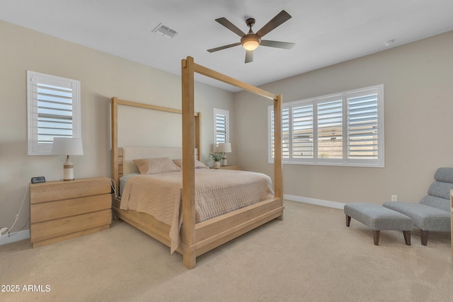 bedroom featuring ceiling fan, carpet floors, visible vents, and baseboards