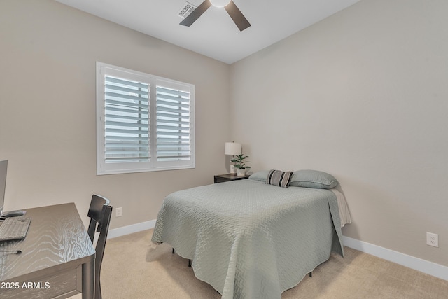 bedroom featuring baseboards, visible vents, ceiling fan, and light colored carpet