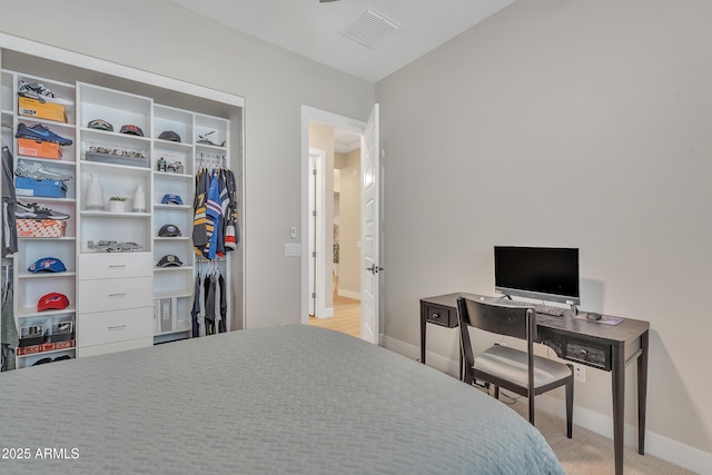 bedroom with baseboards and visible vents