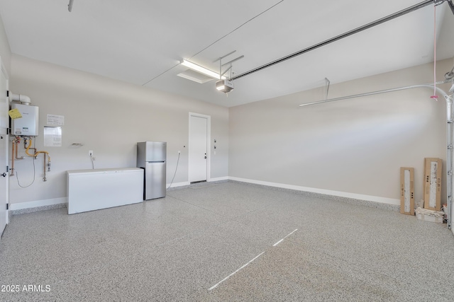 garage featuring water heater, baseboards, freestanding refrigerator, and a garage door opener