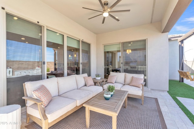 view of patio featuring ceiling fan and an outdoor living space