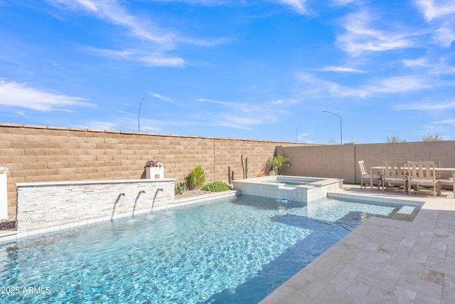 view of pool featuring a patio, a fenced backyard, and a pool with connected hot tub