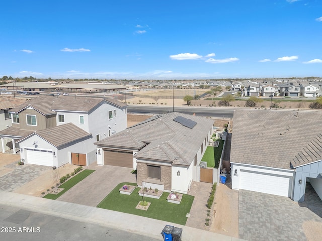 birds eye view of property with a residential view