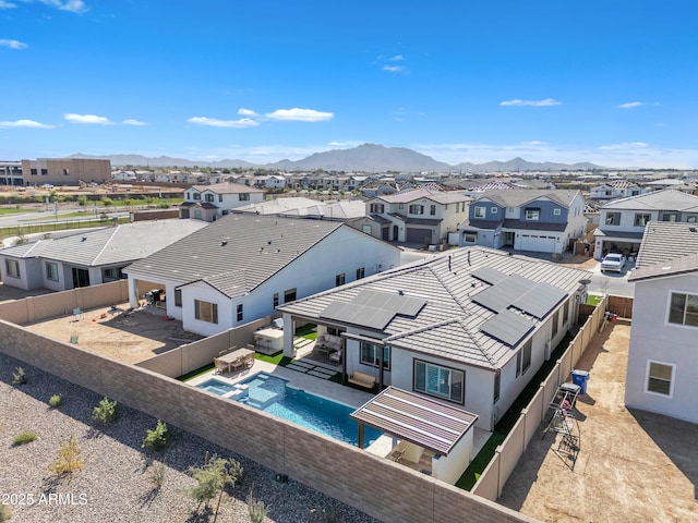 aerial view featuring a mountain view and a residential view