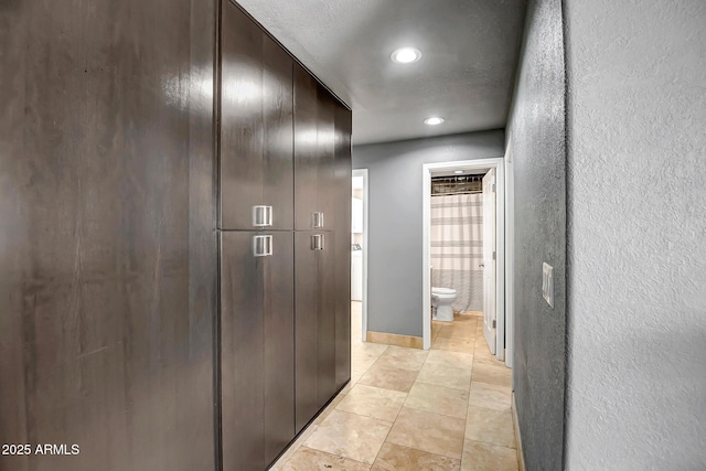 2405 E Lynwood Cir, Mesa, AZ 85213 - hallway with a textured wall, recessed lighting, and light tile patterned flooring