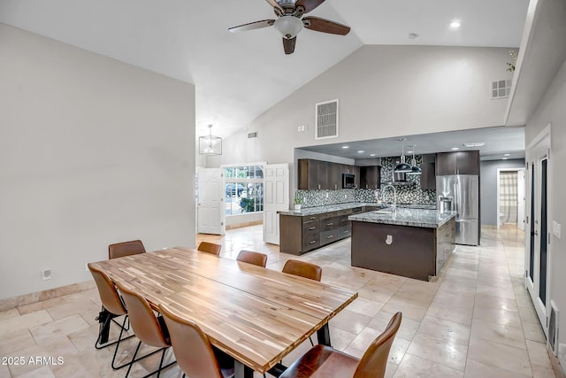 2405 E Lynwood Cir, Mesa, AZ 85213 - dining area featuring a ceiling fan, high vaulted ceiling, baseboards, and recessed lighting