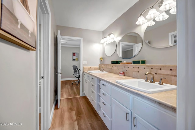 2405 E Lynwood Cir, Mesa, AZ 85213 - bathroom with tasteful backsplash, double vanity, wood finished floors, and baseboards