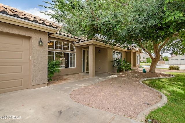 2405 E Lynwood Cir, Mesa, AZ 85213 - view of exterior entry featuring stucco siding and a tiled roof