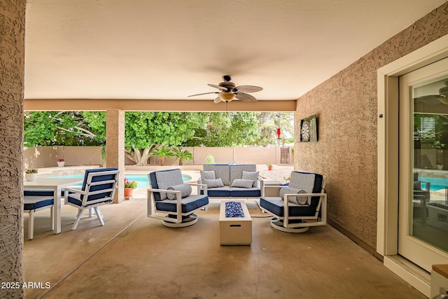 2405 E Lynwood Cir, Mesa, AZ 85213 - fenced backyard featuring a patio area, a ceiling fan, and an outdoor living space with a fire pit