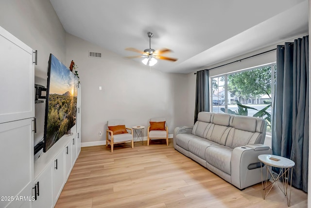 2405 E Lynwood Cir, Mesa, AZ 85213 - living room featuring ceiling fan, light wood-style floors, lofted ceiling, and baseboards